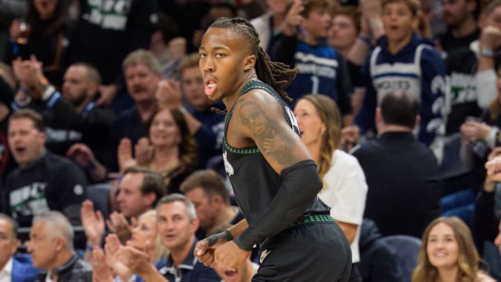Apr 25, 2026; Minneapolis, Minnesota, USA; Minnesota Timberwolves guard Ayo Dosunmu (13) reacts after hitting a three-point shot against the Denver Nuggets in the first quarter at Target Center. Mandatory Credit: Matt Blewett-Imagn Images