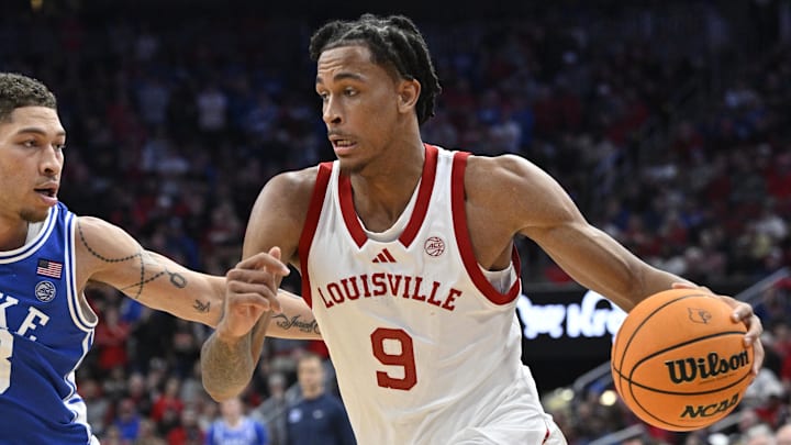 Dec 8, 2024; Louisville, Kentucky, USA;  Louisville Cardinals forward Khani Rooths (9) dribbles against Duke Blue Devils forward Mason Gillis (18) during the second half at KFC Yum! Center. Duke defeated Louisville 76-65. Mandatory Credit: Jamie Rhodes-Imagn Images