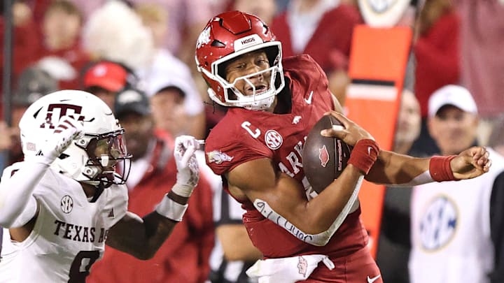 Arkansas Razorbacks quarterback Taylen Green (10) rushes during the fourth quarter as Texas A&M Aggies cornerback Jordan Shaw (8) defends at Razorback Stadium.