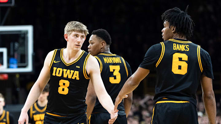 Iowa forward Cooper Koch (8) high-fives Iowa’s Tavion Banks (6) during a Big Ten basketball game against the Nebraska Cornhuskers Feb. 17, 2026 at Carver-Hawkeye Arena in Iowa City, Iowa.