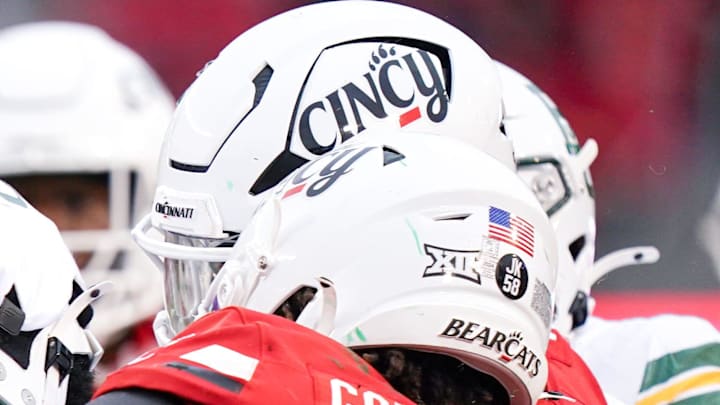 Cincinnati Bearcats safety Trevon Gola-Callard (6) tackles Baylor Bears running back Michael Turner (23) in the third quarter of a NCAA men’s football game between the Cincinnati Bearcats and Baylor Bears, Saturday, Oct. 25, 2025, at Nippert Stadium in Cincinnati. Bearcats won 41-20.