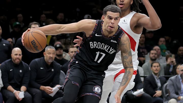 Nov 11, 2025; Brooklyn, New York, USA; Brooklyn Nets forward Michael Porter Jr. (17) drives to the basket against Toronto Raptors forward Collin Murray-Boyles (12) during the fourth quarter at Barclays Center. Mandatory Credit: Brad Penner-Imagn Images Nov 11, 2025; Brooklyn, New York, USA; Brooklyn Nets forward Michael Porter Jr. (17) drives to the basket against Toronto Raptors forward Collin Murray-Boyles (12) during the fourth quarter at Barclays Center. Mandatory Credit: Brad Penner-Imagn Images