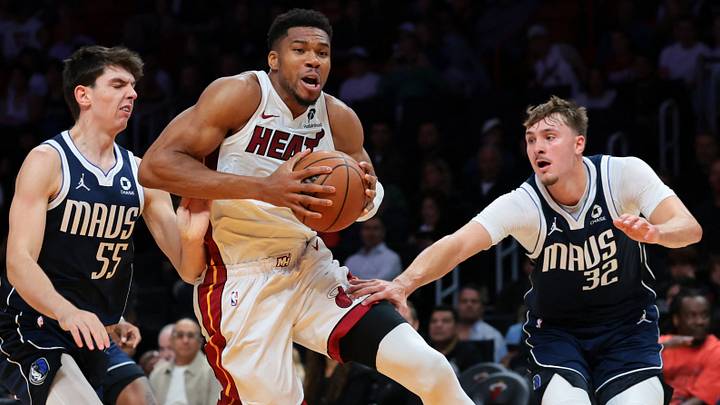 Oct 26, 2026; Miami, Florida, USA; Miami Heat forward Giannis Antetokounmpo (7) drives to the basket against Dallas Mavericks forward Sergio de Larrea (55) and forward Cooper Flagg (32) during the first quarter at Kaseya Center. Mandatory Credit: Sam Navarro-Imagn Images Oct 26, 2026; Miami, Florida, USA; Miami Heat forward Giannis Antetokounmpo (7) drives to the basket against Dallas Mavericks forward Sergio de Larrea (55) and forward Cooper Flagg (32) during the first quarter at Kaseya Center. Mandatory Credit: Sam Navarro-Imagn Images
