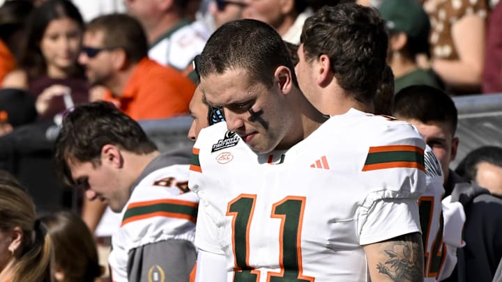 Dec 20, 2025; College Station, TX, USA; Miami Hurricanes quarterback Carson Beck (11) looks down during the game between the Texas A&M Aggies and the Miami Hurricanes at Kyle Field. Mandatory Credit: Jerome Miron-Imagn Images