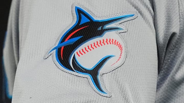 Aug 26, 2024; Denver, Colorado, USA; Detailed view of a Miami Marlins jersey emblem patch worn by Miami Marlins third base coach Griffin Benedict (81) during the sixth inning against the Colorado Rockies at Coors Field. Mandatory Credit: Ron Chenoy-Imagn Images Aug 26, 2024; Denver, Colorado, USA; Detailed view of a Miami Marlins jersey emblem patch worn by Miami Marlins third base coach Griffin Benedict (81) during the sixth inning against the Colorado Rockies at Coors Field. Mandatory Credit: Ron Chenoy-Imagn Images