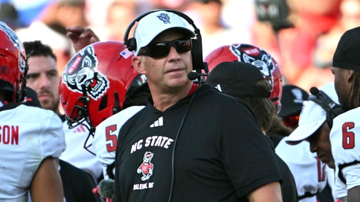 Sep 20, 2025; Durham, North Carolina, USA;  NC State Wolfpack head coach Dave Doeren during the second quarter against the Duke Blue Devils at Wallace Wade Stadium. Mandatory Credit: Zachary Taft-Imagn Images