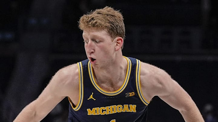 Dec 18, 2024; Charlotte, North Carolina, USA; Michigan Wolverines center Danny Wolf (1) handles the ball against the Oklahoma Sooners during the second half at Spectrum Center. Mandatory Credit: Jim Dedmon-Imagn Images
