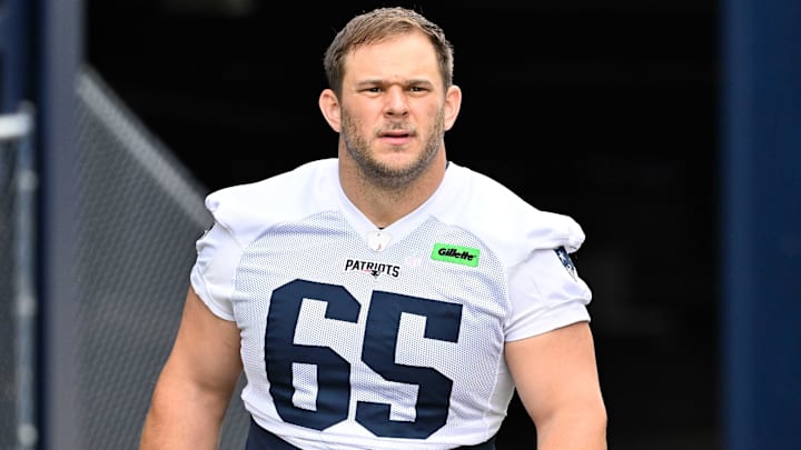 Jun 9, 2025; Foxborough, MA, USA; New England Patriots center Garrett Bradbury (65) walks to the practice fields at Gillette Stadium. Mandatory Credit: Eric Canha-Imagn Images