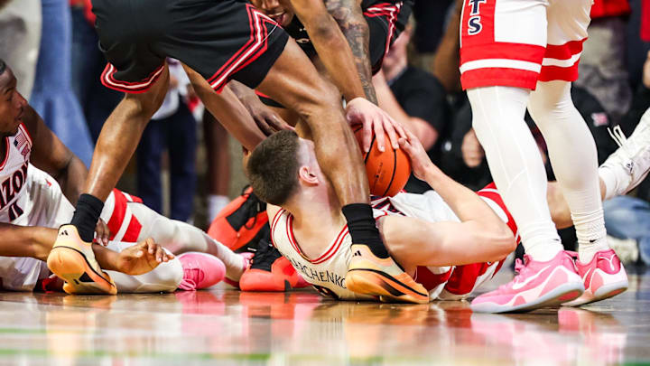 Feb 14, 2026; Tucson, Arizona, USA; Arizona Wildcats forward Ivan Kharchenkov (8) attempts to keep possession of the ball on the ground during overtime against the Texas Tech Red Raiders at McKale Memorial Center. Mandatory Credit: Aryanna Frank-Imagn Images