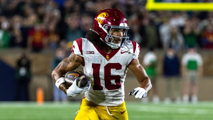 Oct 18, 2025; South Bend, Indiana, USA;  Southern California Trojans wide receiver Tanook Hines (16) runs the ball against the Notre Dame Fighting Irish during the first half  at Notre Dame Stadium. Mandatory Credit: Michael Caterina-Imagn Images