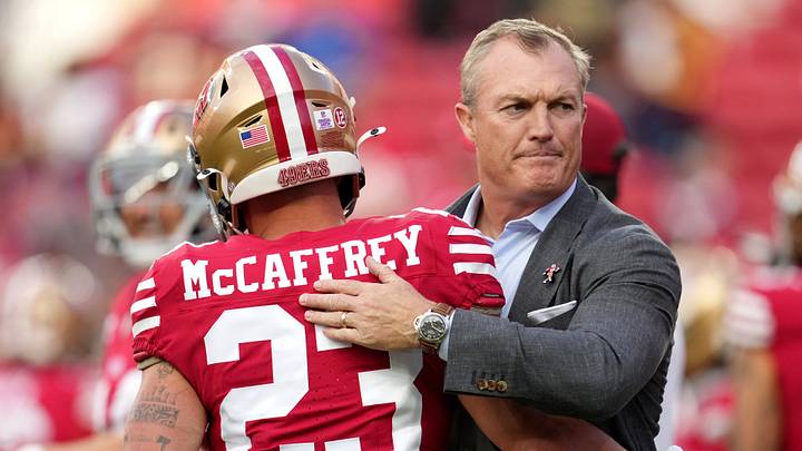 San Francisco 49ers General Manager John Lynch greets San Francisco 49ers running back Christian McCaffrey