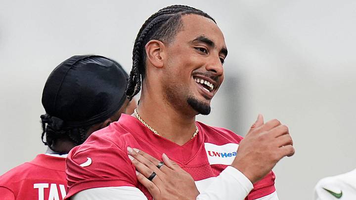 Green Bay Packers quarterback Jordan Love smiles before practice at minicamp.