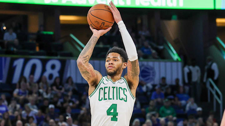 Nov 9, 2025; Orlando, Florida, USA; Boston Celtics guard Anfernee Simons (4) shoots a three point basket during the second quarter against the Orlando Magic at Kia Center. Mandatory Credit: Mike Watters-Imagn Images
