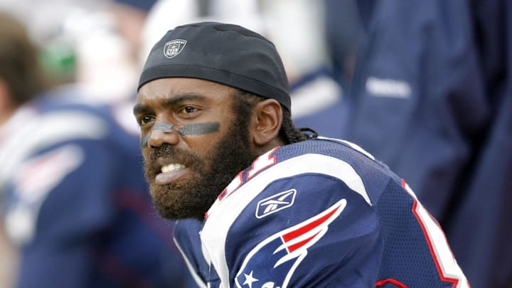 Dec 27, 2009; Foxborough, MA, USA; New England Patriots wide receiver Randy Moss (81) on the sideline as they take on the Jacksonville Jaguars during the second quarter at Gillette Stadium. The Patriots defeated the Jaguars 35-7. Mandatory Credit: David Butler II-Imagn Images