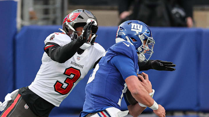 Nov 24, 2024; East Rutherford, New Jersey, USA; New York Giants quarterback Tommy DeVito (15) is tackled by Tampa Bay Buccaneers safety Jordan Whitehead (3) during the second half at MetLife Stadium. Mandatory Credit: Vincent Carchietta-Imagn Images Nov 24, 2024; East Rutherford, New Jersey, USA; New York Giants quarterback Tommy DeVito (15) is tackled by Tampa Bay Buccaneers safety Jordan Whitehead (3) during the second half at MetLife Stadium. Mandatory Credit: Vincent Carchietta-Imagn Images