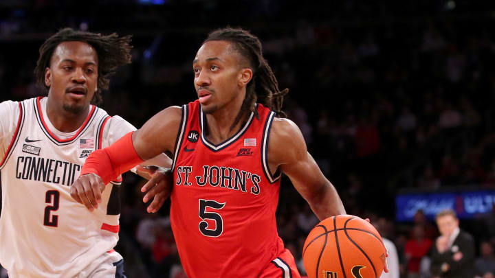 Mar 15, 2024; New York City, NY, USA; St. John's Red Storm guard Daniss Jenkins (5) drives to the basket against Connecticut Huskies guard Tristen Newton (2) during the first half at Madison Square Garden. Mandatory Credit: Brad Penner-USA TODAY Sports