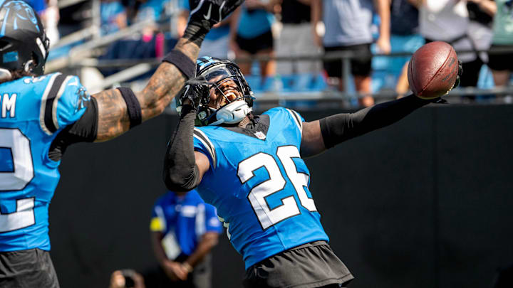 Sep 21, 2025; Charlotte, North Carolina, USA; Carolina Panthers cornerback Chau Smith-Wade (26) celebrates with safety Lathan Ransom (22) after intercepting the ball and scoring a touchdown in the third quarter at Bank of America Stadium. Mandatory Credit: Bob Donnan-Imagn Images