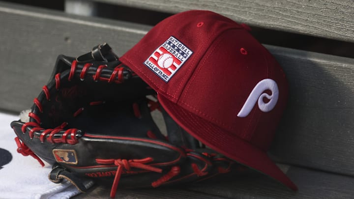 Jul 25, 2025; Bronx, New York, USA; A detailed view of a Hall of Fame patch on a Philadelphia Phillies hat resting in the dugout during the second inning against the New York Yankees at Yankee Stadium. 