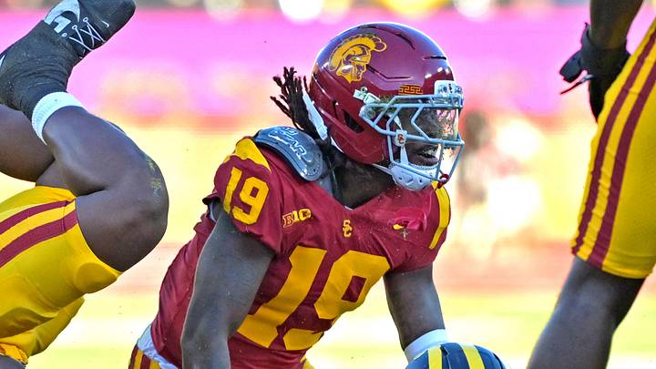 Oct 11, 2025; Los Angeles, California, USA; Michigan Wolverines quarterback Bryce Underwood (19) is stopped by USC Trojans defensive end Braylan Shelby (10) and safety Bishop Fitzgerald (19) after he ran the ball in the first half at United Airlines Field at the Los Angeles Memorial Coliseum. Mandatory Credit: Jayne Kamin-Oncea-Imagn Images Oct 11, 2025; Los Angeles, California, USA; Michigan Wolverines quarterback Bryce Underwood (19) is stopped by USC Trojans defensive end Braylan Shelby (10) and safety Bishop Fitzgerald (19) after he ran the ball in the first half at United Airlines Field at the Los Angeles Memorial Coliseum. Mandatory Credit: Jayne Kamin-Oncea-Imagn Images
