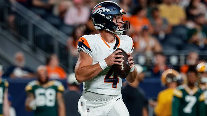 Aug 21, 2026; Denver, Colorado, USA; Denver Broncos quarterback Sam Ehlinger (4) drops back in the fourth quarter against the Green Bay Packers at Empower Field at Mile High. Aug 21, 2026; Denver, Colorado, USA; Denver Broncos quarterback Sam Ehlinger (4) drops back in the fourth quarter against the Green Bay Packers at Empower Field at Mile High.