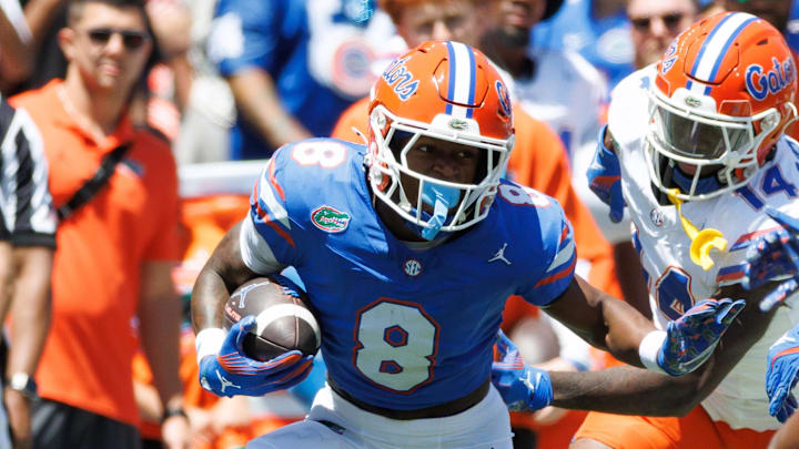 Apr 12, 2025; Gainesville, FL, USA; Florida Gators wide receiver Vernell Brown III (8) runs with the ball during the first half at Ben Hill Griffin Stadium. Mandatory Credit: Matt Pendleton-Imagn Images