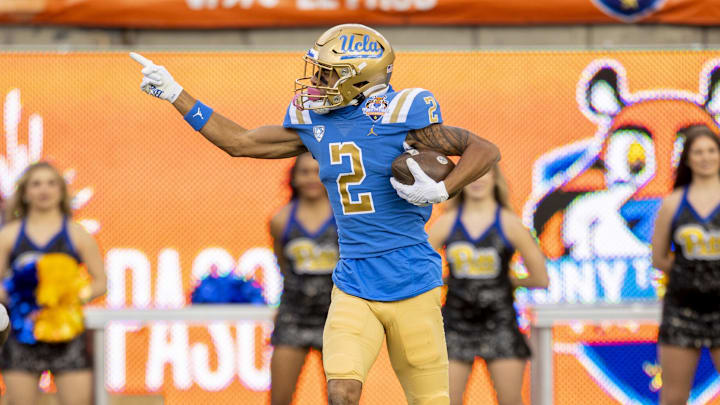 Dec 30, 2022; El Paso, Texas, USA; UCLA Bruins wide receiver Titus Mokiao-Atimalala (2) celebrates after making a catch against the Pittsburgh Panthers defense in the first half in the 2022 Sun Bowl at Sun Bowl. Mandatory Credit: Ivan Pierre Aguirre-Imagn Images