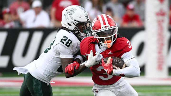 Oct 18, 2025; Bloomington, Indiana, USA; Indiana Hoosiers wide receiver Omar Cooper Jr. (3) runs after a catch against Michigan State Spartans defensive back Dontavius Nash (28) during the first half at Memorial Stadium. Mandatory Credit: Robert Goddin-Imagn Images Oct 18, 2025; Bloomington, Indiana, USA; Indiana Hoosiers wide receiver Omar Cooper Jr. (3) runs after a catch against Michigan State Spartans defensive back Dontavius Nash (28) during the first half at Memorial Stadium. Mandatory Credit: Robert Goddin-Imagn Images
