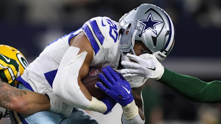 Jan 14, 2024; Arlington, Texas, USA; Dallas Cowboys running back Tony Pollard (20) rushes the ball against the Green Bay Packers during the first half for the 2024 NFC wild card game at AT&T Stadium. Mandatory Credit: Tim Heitman-Imagn Images