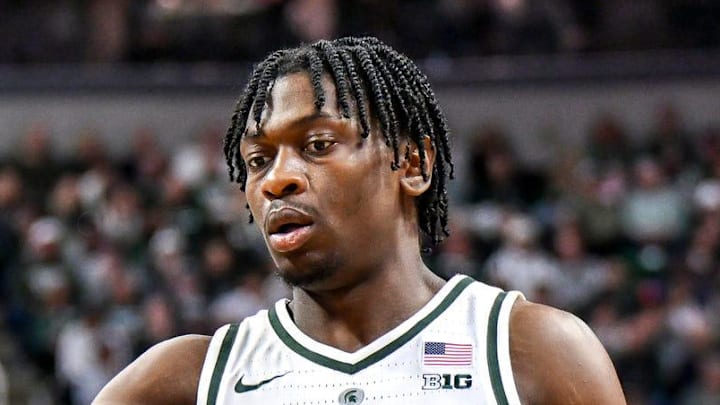 Michigan State's Coen Carr, left, slaps hands with Trey Fort after Carr drew an Ohio State foul during the first half on Sunday, Feb. 22, 2026, at the Breslin Center in East Lansing.