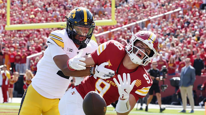 Sep 6, 2025; Ames, Iowa, USA; Iowa Hawkeyes defensive back TJ Hall (2) breaks up a pass intended for Iowa State Cyclones wide receiver Brett Eskildsen (9) during the first quarter at Jack Trice Stadium. Mandatory Credit: Reese Strickland-Imagn Images