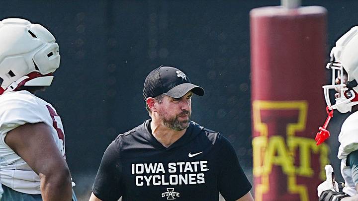 Iowa State football head coach Jimmy Rogers watches the defense warm up during the university’s football open practice at Johnny Majors practice field on August 8, 2026, in Ames, Iowa.