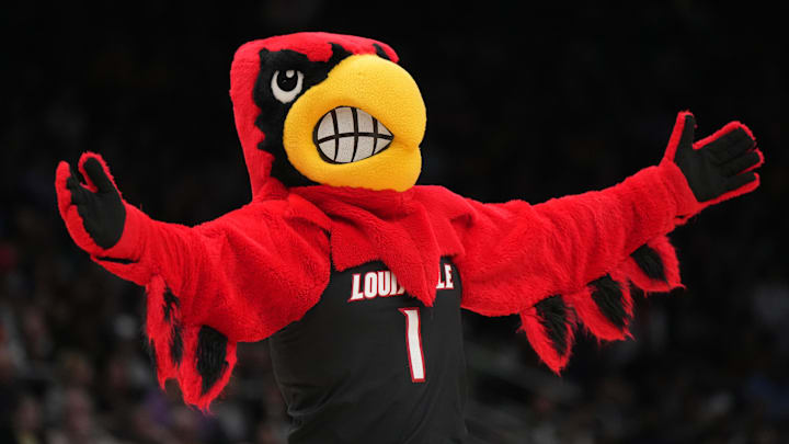 Mar 26, 2023; Seattle, WA, USA; Louisville Cardinals mascot Louie gestures in the first half against the Iowa Hawkeyes at Climate Pledge Arena. Mandatory Credit: Kirby Lee-Imagn Images