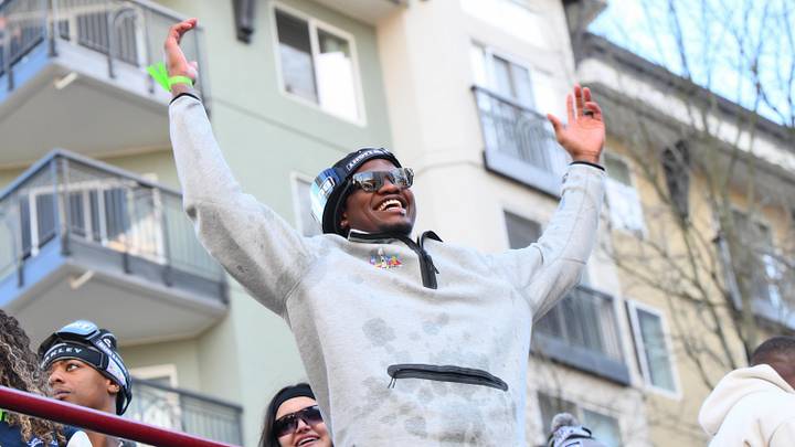 Feb 11, 2026; Seattle, WA, USA; Seattle Seahawks running back Kenneth Walker III (9) interacts with fans during the Super Bowl LX World Champions parade in downtown Seattle. Mandatory Credit: Steven Bisig-Imagn Images