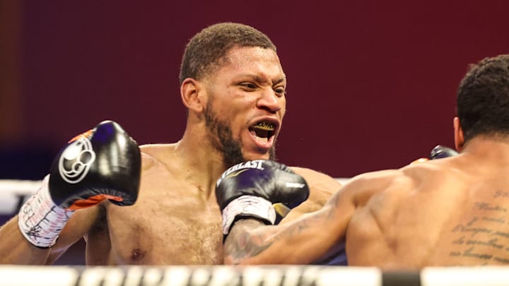 Brian Norman Jr. throws a right hand against Derrieck Cuevas.
