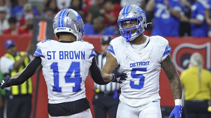 Detroit Lions running back David Montgomery (5) celebrates with wide receiver Amon-Ra St. Brown (14)