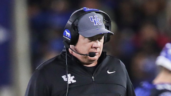 Kentucky head coach Mark Stoops walks the field during a time out as his special teams practice snapping the ball for extra point attempts at Kroger Field Saturday, Oct. 12, 2024 in Lexington, Ky.