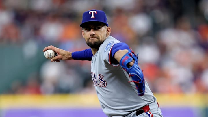 Jul 13, 2025; Houston, Texas, USA; Texas Rangers starting pitcher Nathan Eovaldi (17) delivers a pitch against the Houston Astros during the first inning at Daikin Park. 