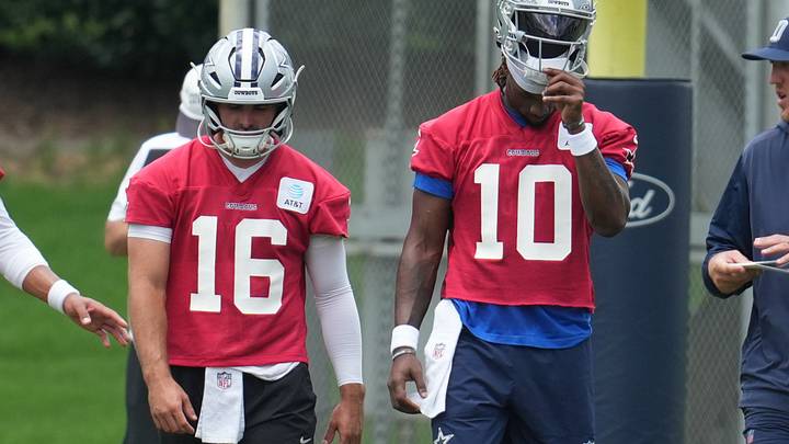 Dallas Cowboys quarterbacks Sam Howell and Joe Milton III walk onto the field during practice at the Ford Center.
