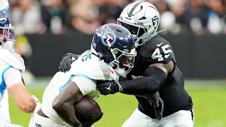 Oct 12, 2025; Paradise, Nevada, USA; Tennessee Titans running back Tyjae Spears (2) runs the ball during the first half against Las Vegas Raiders linebacker Devin White (45) at Allegiant Stadium. Mandatory Credit: Stephen R. Sylvanie-Imagn Images