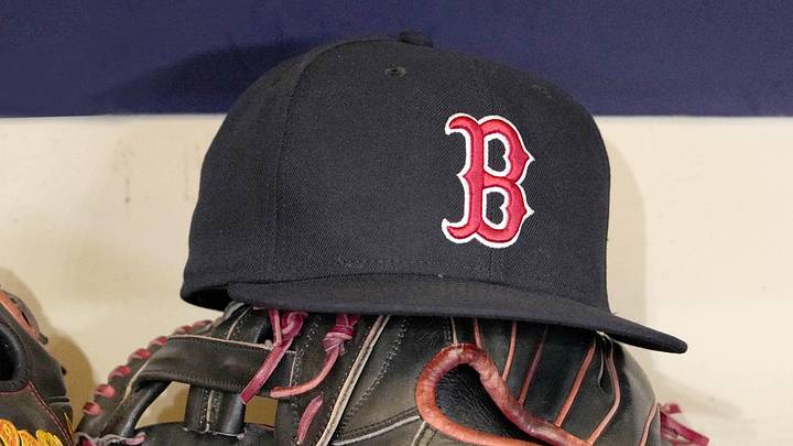 May 27, 2025; Milwaukee, Wisconsin, USA; A Boston Red Sox hat and glove sit in the dug out before a game against the Milwaukee Brewers at American Family Field. May 27, 2025; Milwaukee, Wisconsin, USA; A Boston Red Sox hat and glove sit in the dug out before a game against the Milwaukee Brewers at American Family Field.