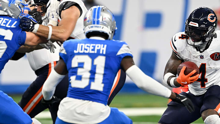 Chicago Bears running back D'Andre Swift (4) carries the ball defended by Detroit Lions safety Kerby Joseph (31) Chicago Bears running back D'Andre Swift (4) carries the ball defended by Detroit Lions safety Kerby Joseph (31)