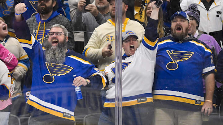 Oct 23, 2025; St. Louis, Missouri, USA; St. Louis Blues fans react after St. Louis Blues center Pius Suter (not pictured) scored against the Utah Mammoth during the second period at Enterprise Center. Mandatory Credit: Jeff Curry-Imagn Images