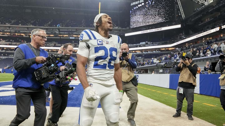 Dec 22, 2024; Indianapolis, Indiana, USA; Indianapolis Colts running back Jonathan Taylor (28) celebrates as he leaves the field after winning a game against the Tennessee Titans at Lucas Oil Stadium. 