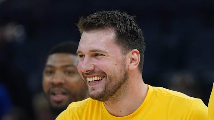 Feb 28, 2026; San Francisco, California, USA;  Los Angeles Lakers forward/guard Luka Doncic (77) laughs with forward-center Maxi Kleber (14) during pre-game warmups during a game against the Golden State Warriors at Chase Center. Mandatory Credit: David Gonzales-Imagn Images