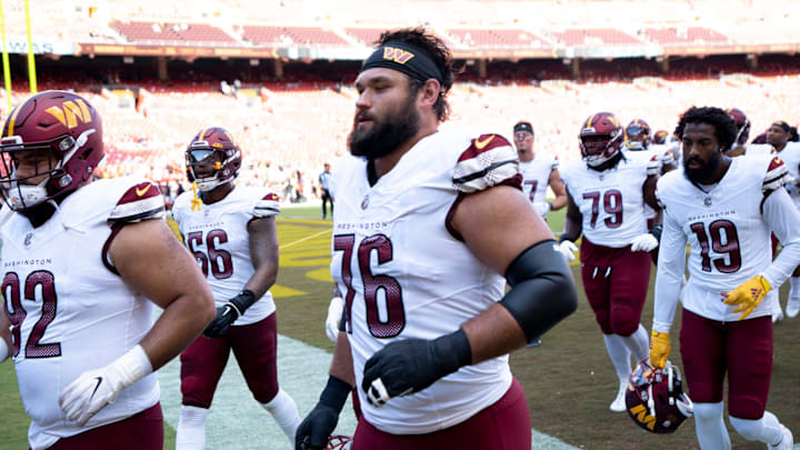 Washington Commanders offensive tackle Sam Cosmi (76) and others run into the locker room before the NFL preseason week 3 game between the Cincinnati Bengals and the Washington Commanders at FedEx Field in Landover, M.D., on Saturday, Aug. 26, 2023.