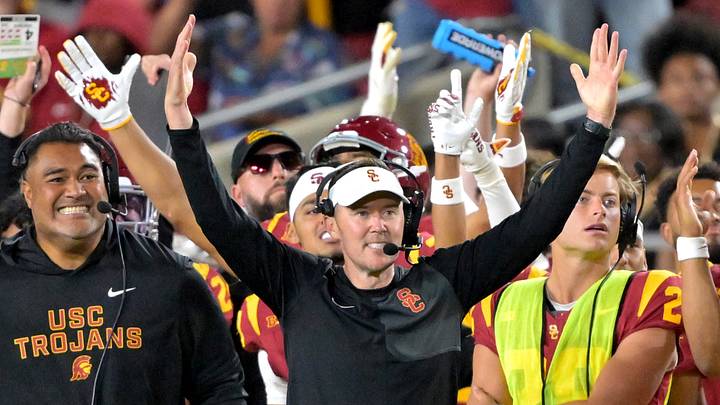 USC Trojans head coach Lincoln Riley and defensive line coach Shaun Nua celebrate on the sideline. USC Trojans head coach Lincoln Riley and defensive line coach Shaun Nua celebrate on the sideline.