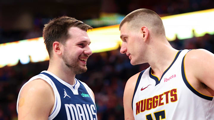 Mar 17, 2024; Dallas, Texas, USA; Dallas Mavericks guard Luka Doncic (77) speaks with Denver Nuggets center Nikola Jokic (15) during the second half at American Airlines Center. Mar 17, 2024; Dallas, Texas, USA; Dallas Mavericks guard Luka Doncic (77) speaks with Denver Nuggets center Nikola Jokic (15) during the second half at American Airlines Center.