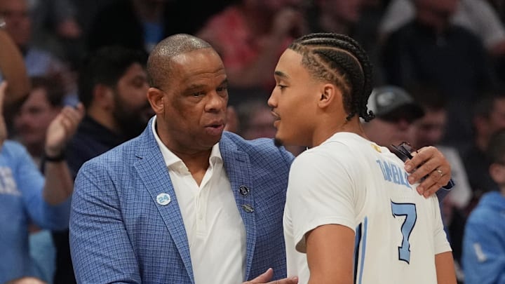 March 21, 2024, Charlotte, NC, USA;  North Carolina Tar Heels head coach Hubert Davis talks with guard Seth Trimble (7) as they play against the Wagner Seahawks in the first round of the 2024 NCAA Tournament at the Spectrum Center. Mandatory Credit: Jim Dedmon-Imagn Images