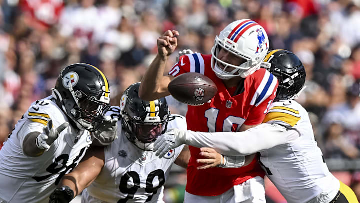 Sep 21, 2025; Foxborough, Massachusetts, USA; New England Patriots quarterback Drake Maye (10) fumbles the ball during the fourth quarter at Gillette Stadium. Mandatory Credit: Brian Fluharty-Imagn Images