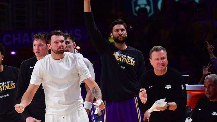 Los Angeles Lakers guard Luka Doncic (77) and the bench react against the Houston Rockets during the second half in game five of the first round of the 2026 NBA Playoffs at Crypto.com Arena. Mandatory Credit: Gary A. Vasquez-Imagn Images